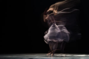 long-exposure photograph of a dancer in motion