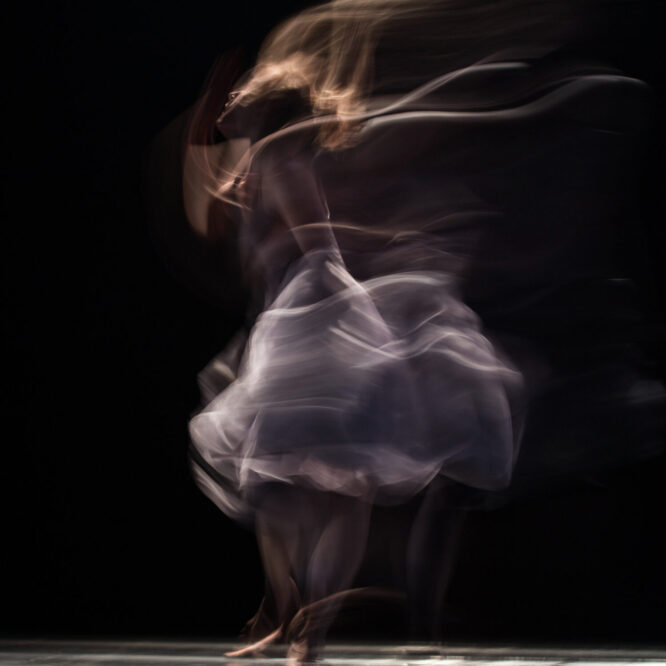 long-exposure photograph of a dancer in motion